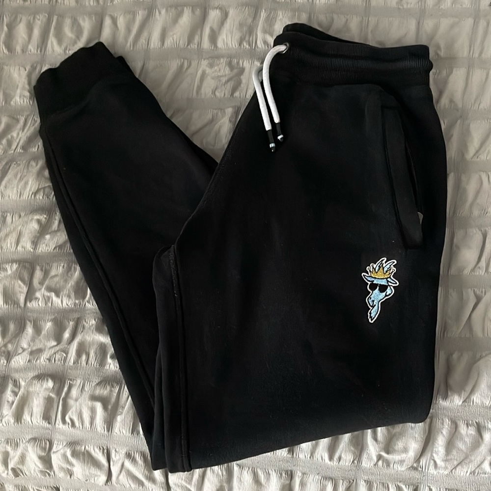 GOAT joggers with light blue logo